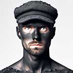 coalman's face mired in coal dust with only his eyes showing white