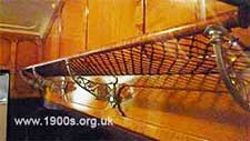 luggage rack, corded like a hammock, 1940s and 1950s Britain and probably before
