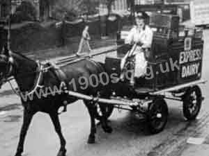 Horse-drawn milk deliveries driven by a woman in World War Two