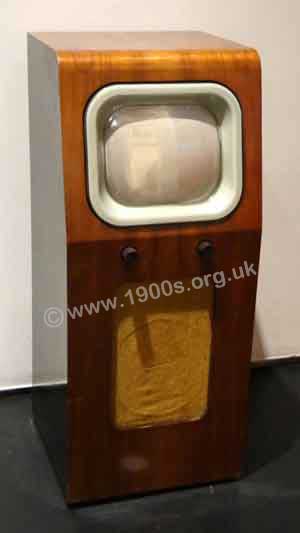 vintage television in polished wood cabinet
