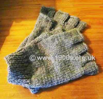 Vintage knitted gloves without fingers for tradesmen handling money