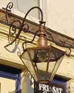 Typical old gas lamp, as hung outside public houses in the UK