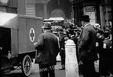 Convoy of ambulances leaving a London station transporting wounded WW1 soldiers to the military hospitals. The red cross is clearly shown on the front of the nearest ambulance