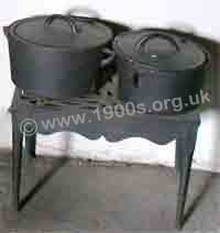 oid cast iron cooking pots on a cast iron trivet.