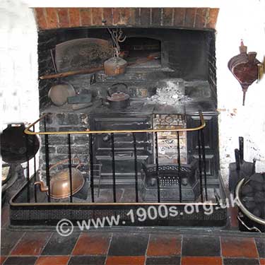 kitchen fire showing bread oven and fireguard