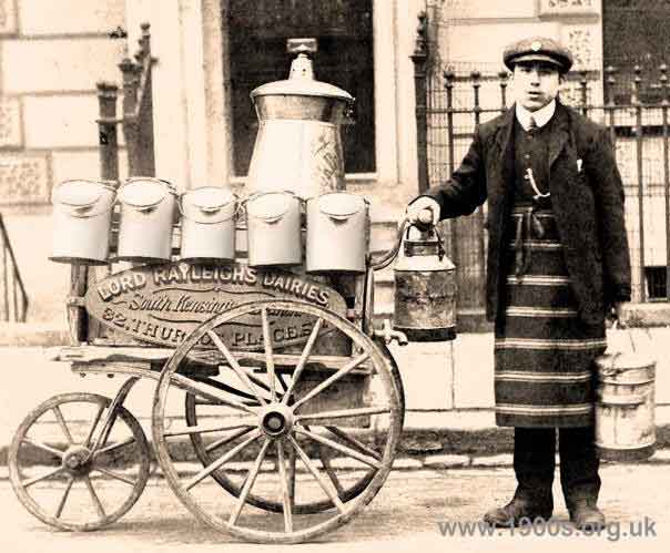 Milk delivery boy with handcart, jugs and churns, early 20th century