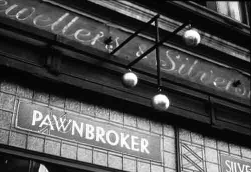 pawnbroker's shop showing the name plate, glass front and pawnbroker sign of three gold balls