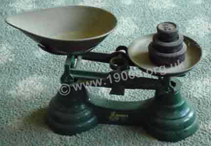 Early 1900s scales suitably shaped for tipping out goods into a much smaller receptacle.