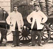 Men who drove the coal delivery carts in the first half of the 20th century, showing their summer dress code of white coats