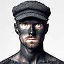 coalman's face mired in coal dust with only his eyes showing white