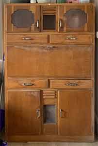 dark wood 1930s kitchen cabinet with all cupbards, drawers and pastry-board the same depth