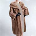 women's fur coat, status symbol 1950s UK