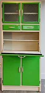 green 1950s kitchen cabinet with integral pastry-board pulled out and down