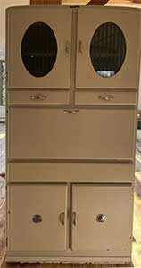 tan kitchen cabinet with cupboards, drawers and closed pull-out pastry board